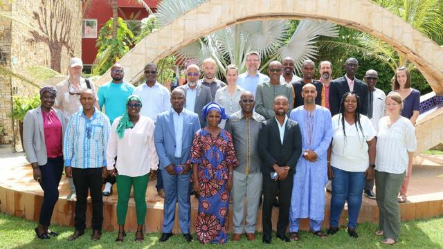 A group of representatives of the project partners standing in 3 rows facing the camera. © BirdLife.